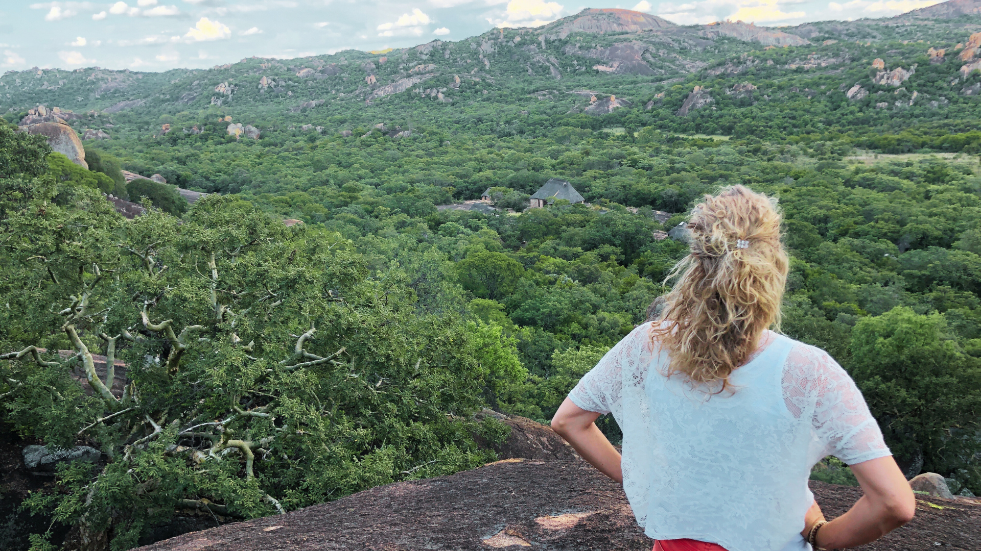 Traveller overlooking the green Matobo Hills landscape.